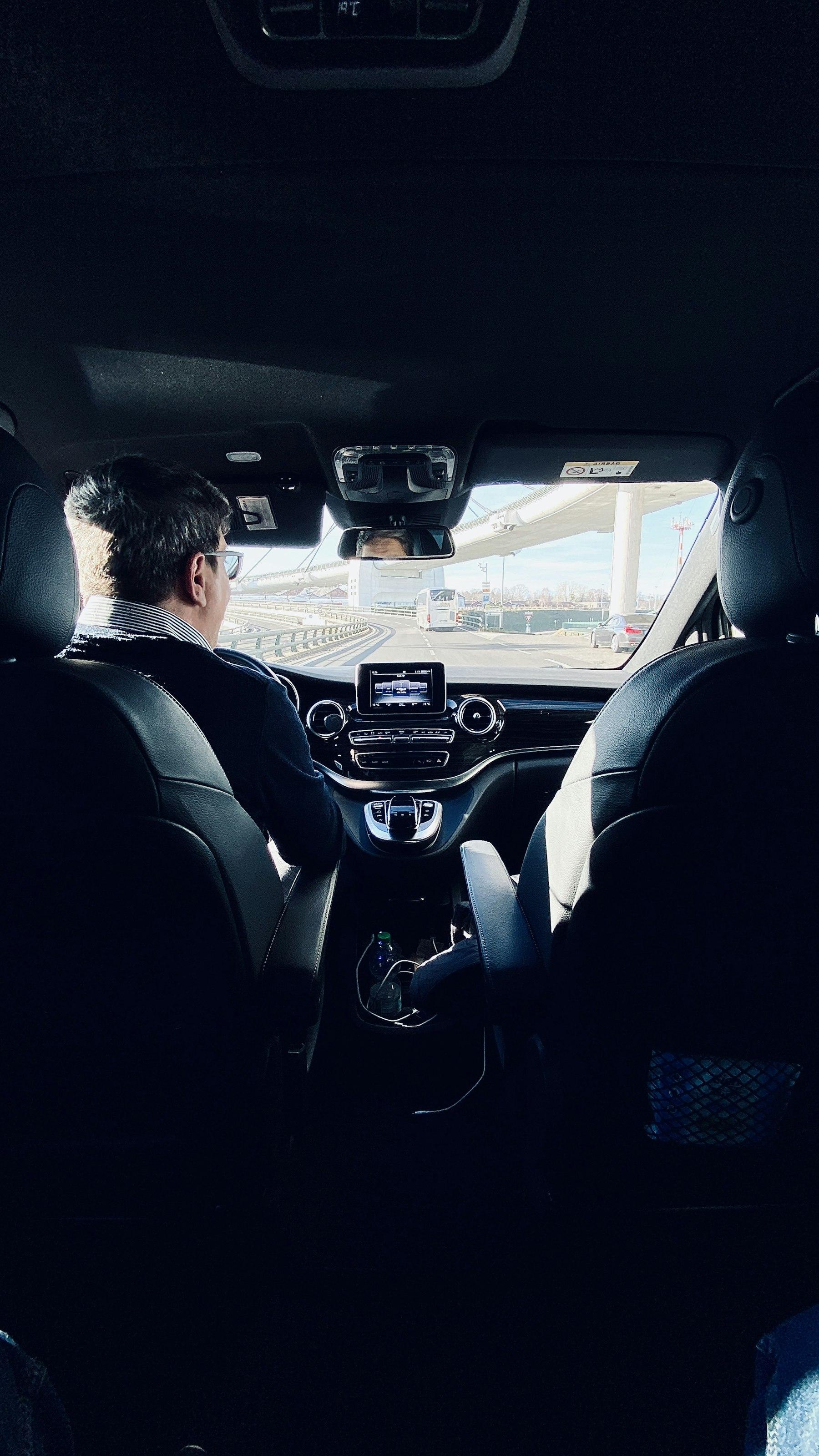 Chauffeur driving a Mercedes-Benz van
